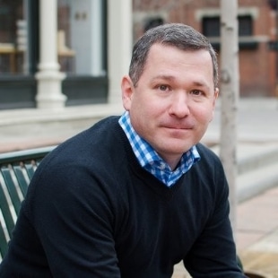 Brian McMahon sitting on a bench